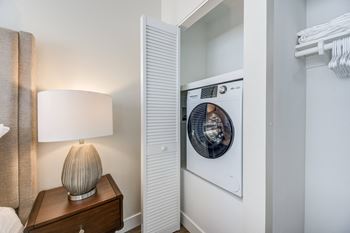 a washer and dryer in a bedroom at Brookside Terrace Apartments, Encino, 91316